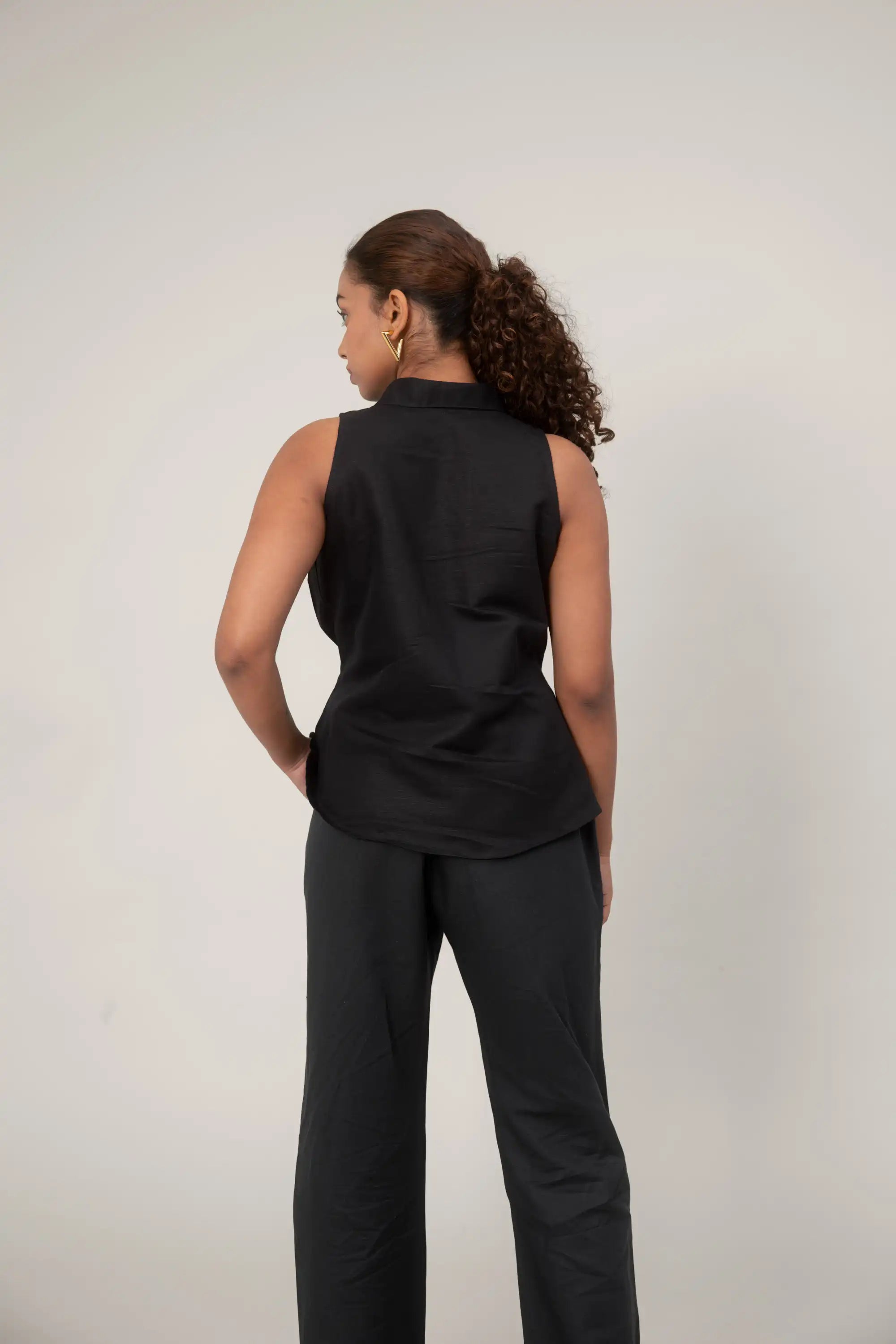 Black Sleeveless Shirt by THE MRCH MUSE