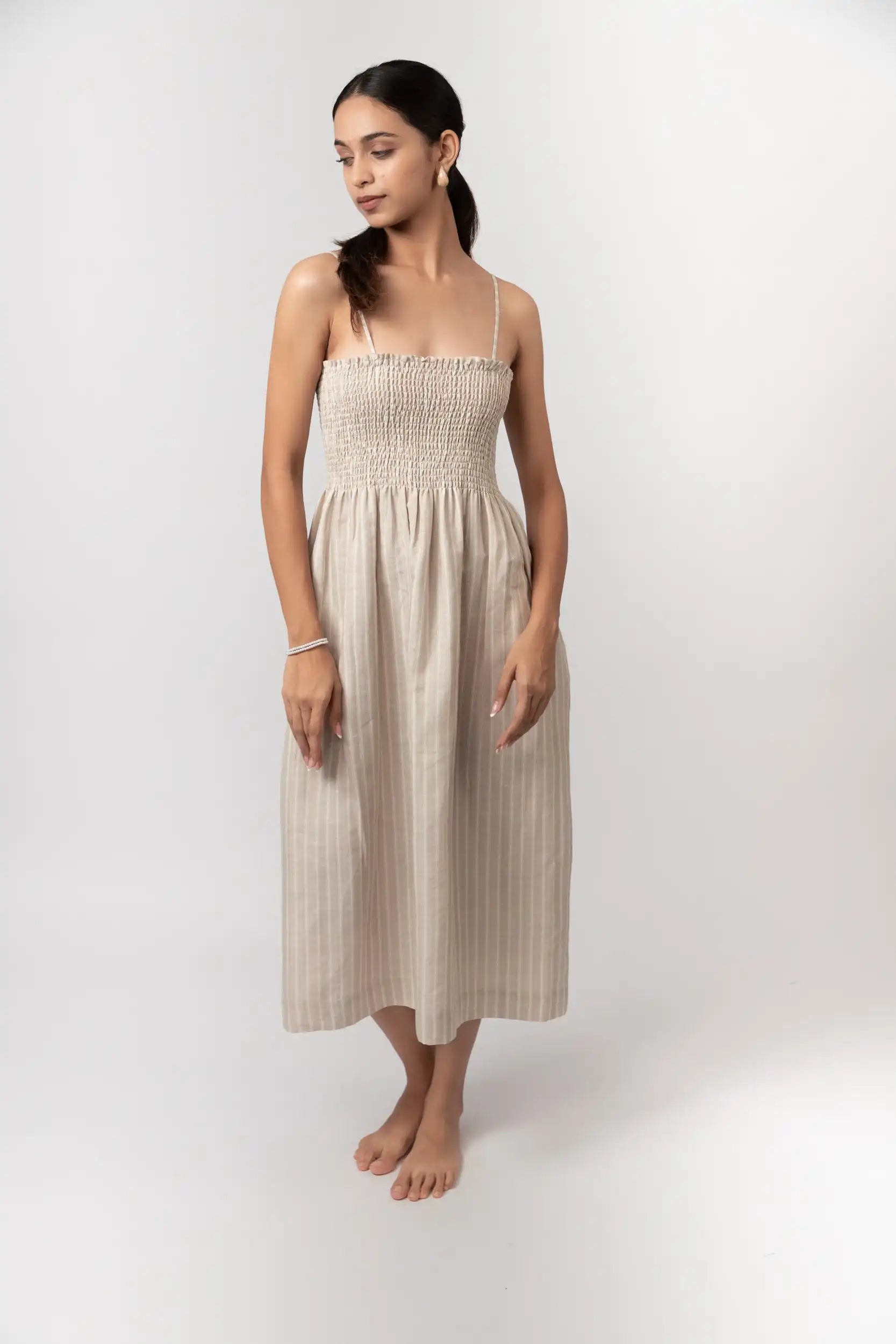 Striped Smocked Midi Dress by THE MRCH MUSE