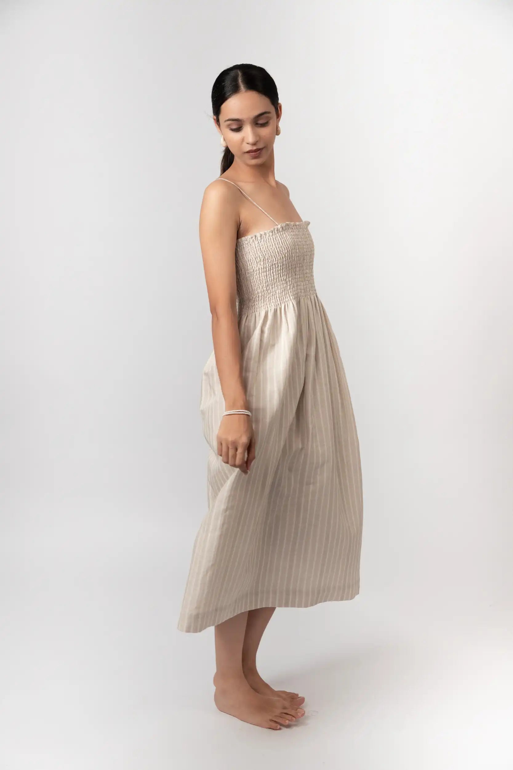 Striped Smocked Midi Dress by THE MRCH MUSE
