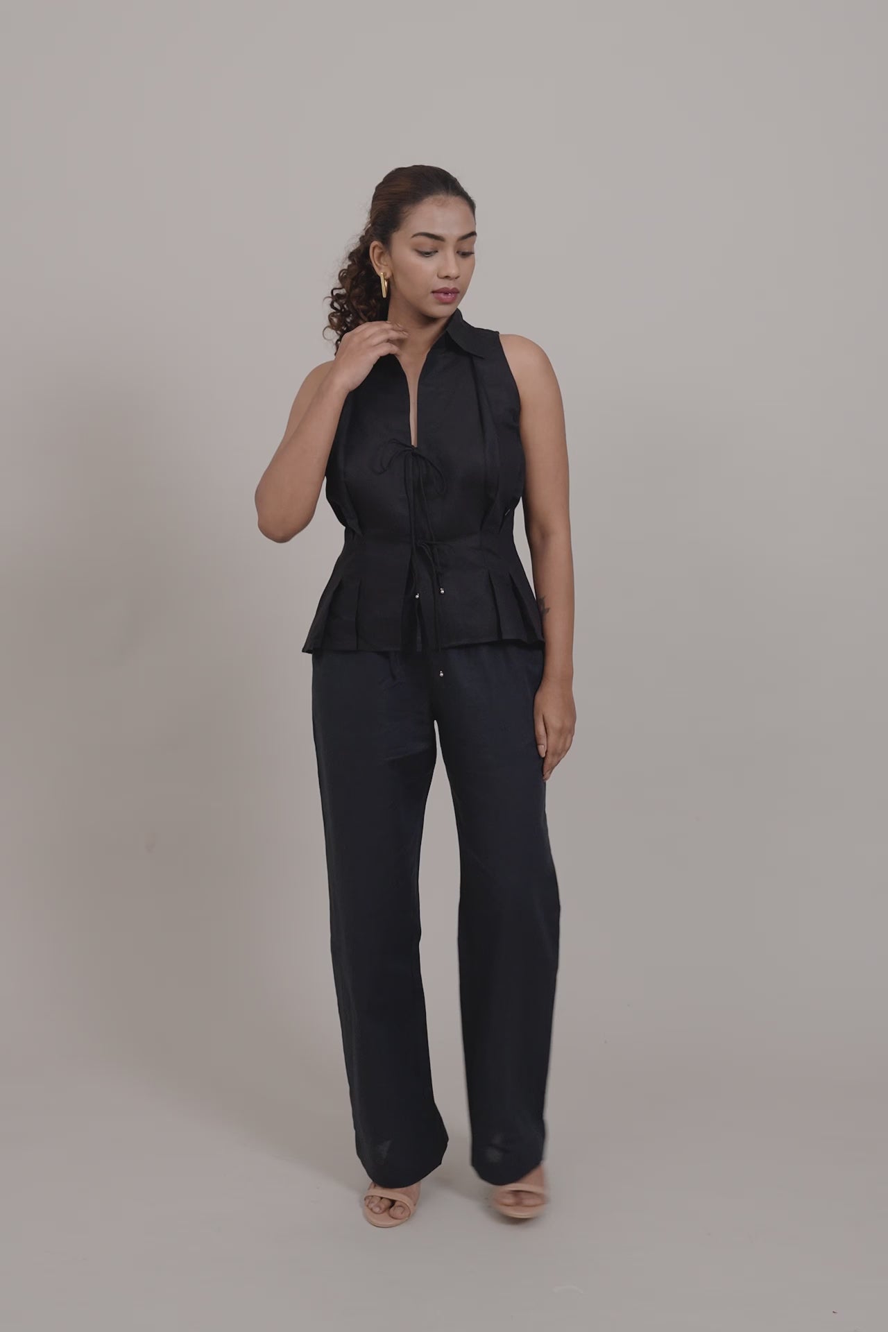 Black Sleeveless Shirt by THE MRCH MUSE
